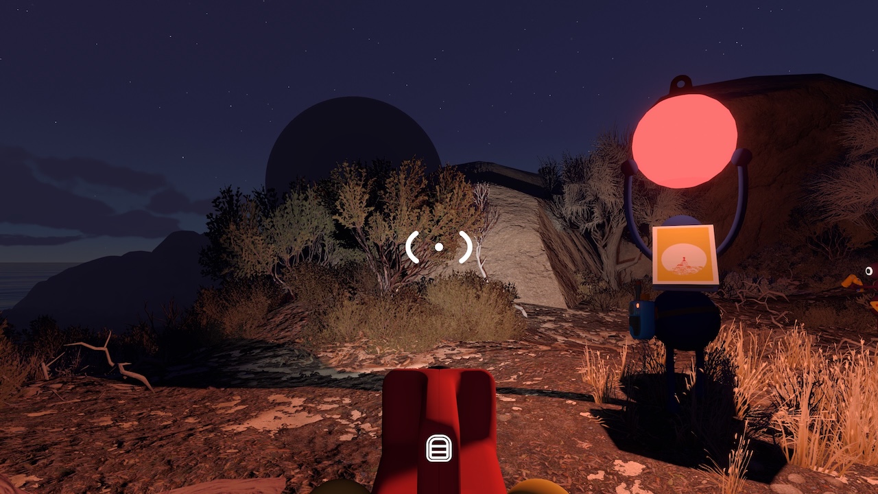 A screenshot from Big Walk, showing a rocky landscape under a night sky with a big shadowy orb in the distance. The first-person-perspective character holds a flashlight in their hands, and another character is seen walking ahead with a folded map on their back and a big glowing ball held above their head, illuminating their surroundings in red light.